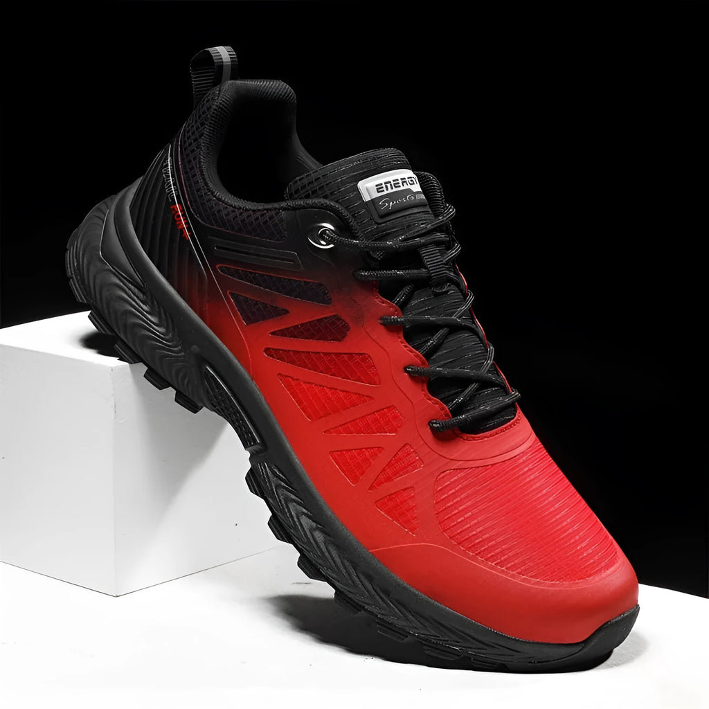 Men's black and orange breathable mesh running shoe with lace-up front on a flat heel.
