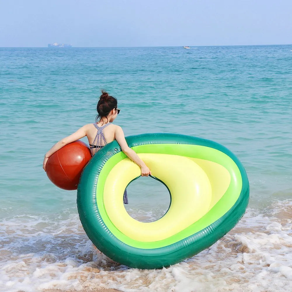 Green giant avocado-shaped inflatable pool float on water