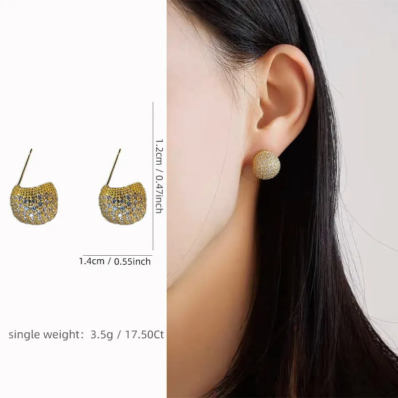 Golden bean earrings with diamond-cut detailing and ear clip fastening in drop shape