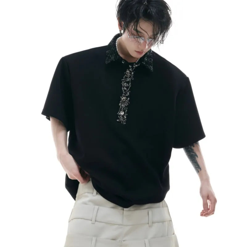 Men's black loose fit polo shirt with square collar and embroidered sequins detail on the front.