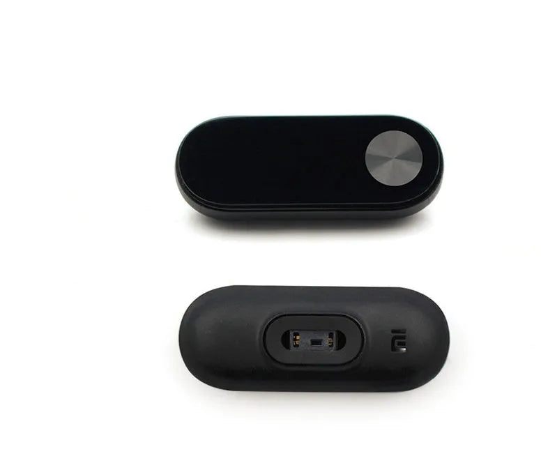 Xiaomi Mi Band 2 black fitness tracker on wrist showing OLED screen display.
