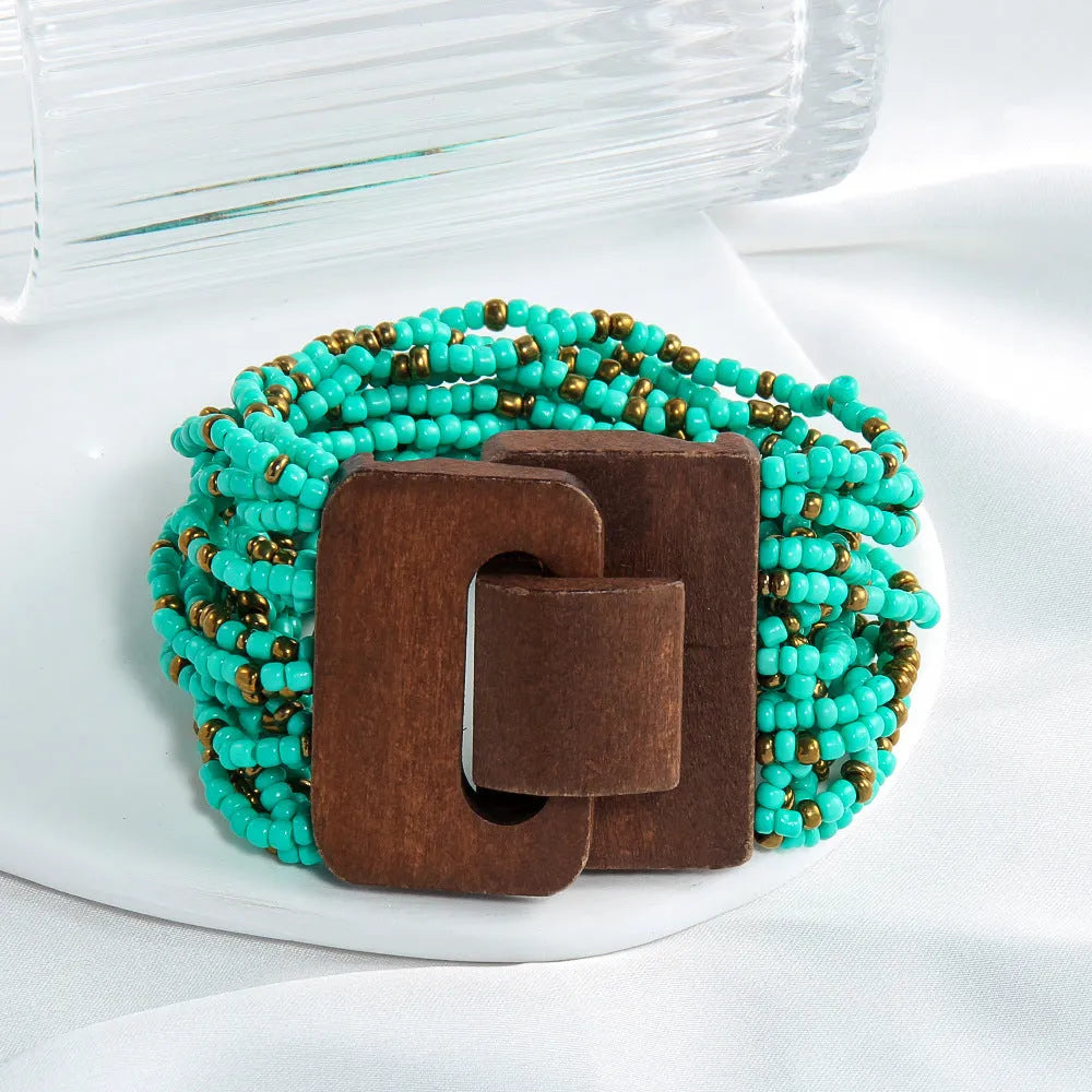 Handmade multi-layer elastic bracelet with rice-shaped glass and coloured glaze beads in geometric quadrilateral pattern, six colour options