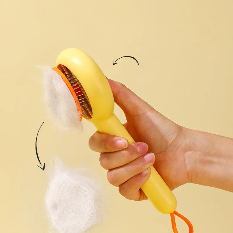 Small yellow duck-shaped pet grooming comb with open sections for cats and dogs