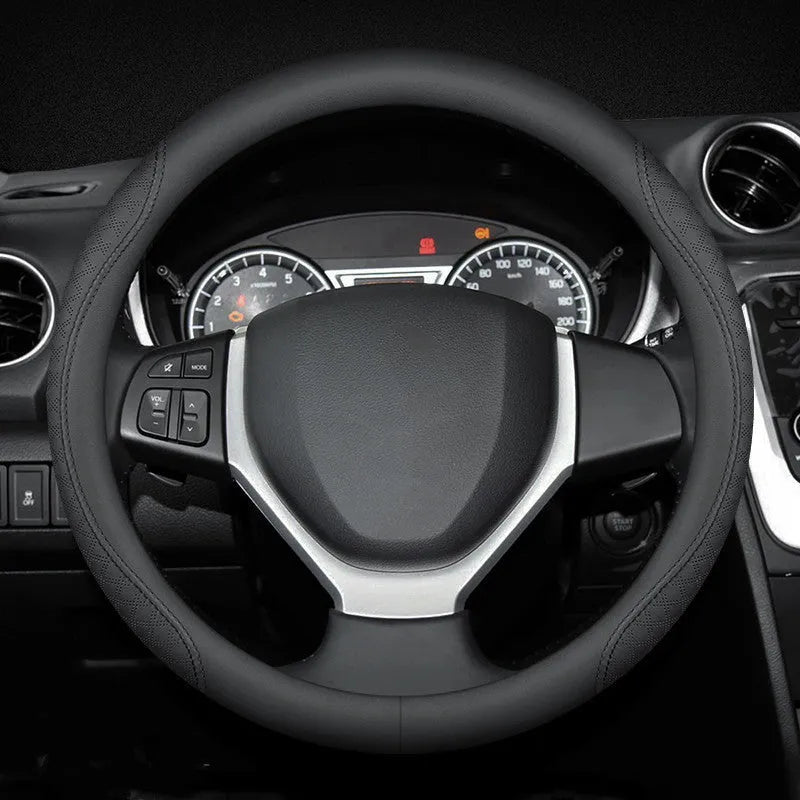 Black leather steering wheel cover with coloured stitching, shown fitted on a car wheel.