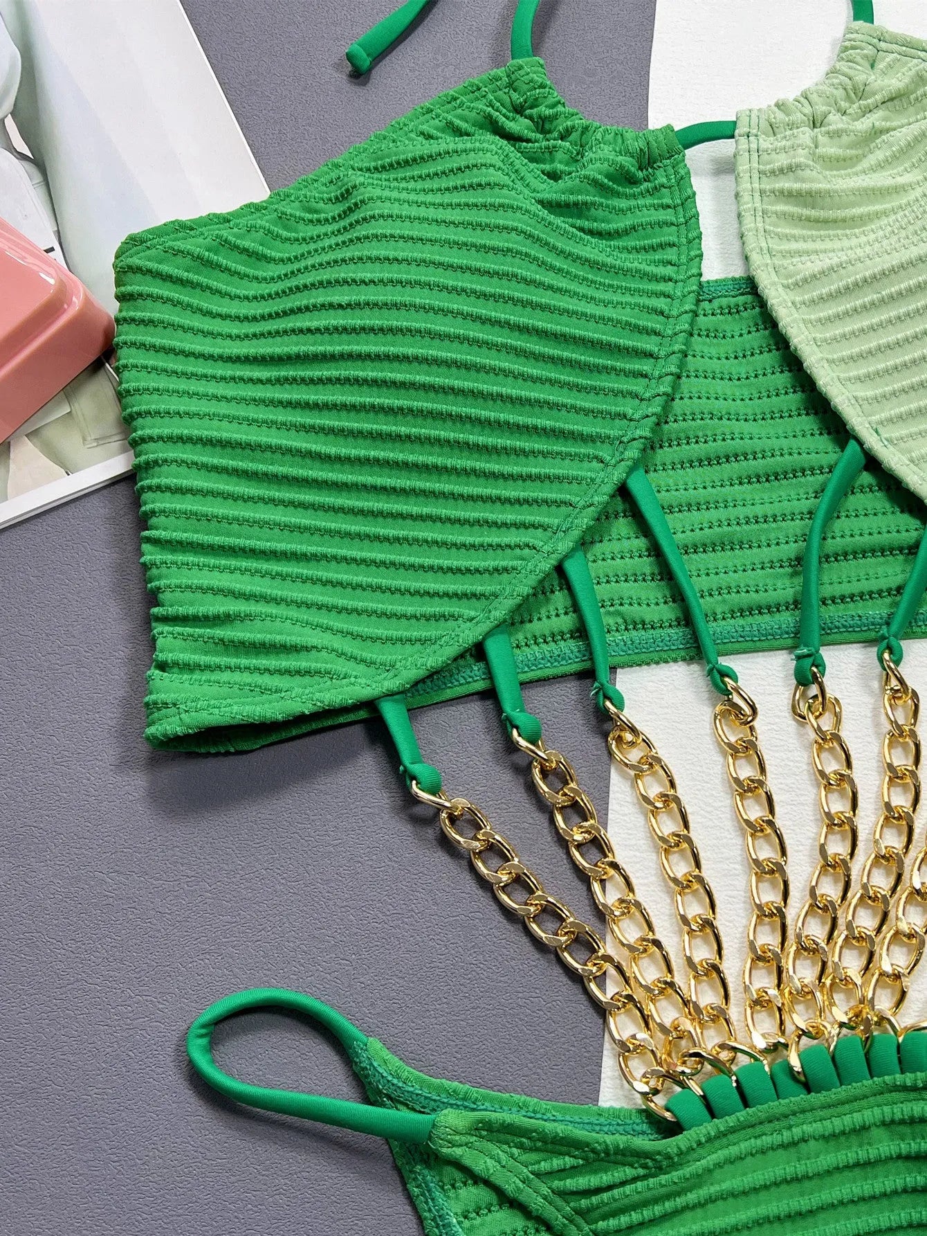 Green women's one-piece swimsuit with hollow cutout design in polyester fabric