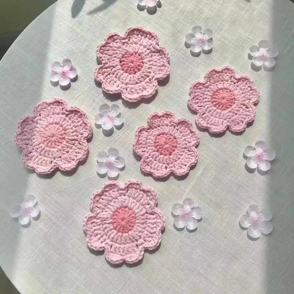 Hand-woven wool coaster in natural colour protecting wooden table from drink