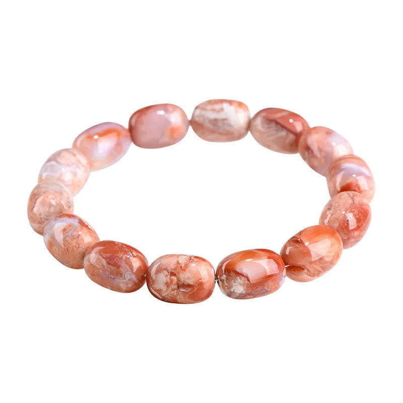 Natural cherry agate bracelet with barrel-shaped beads and a gold Ruyi charm on an adjustable strap.