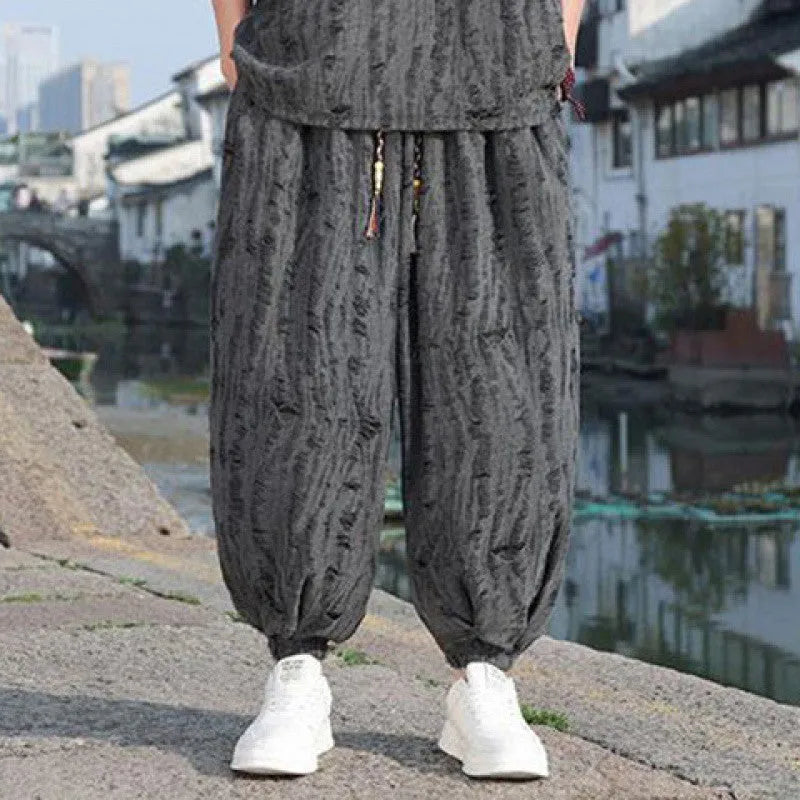 Men's loose two-piece summer suit set with thin short-sleeved top and cropped trousers in black or grey
