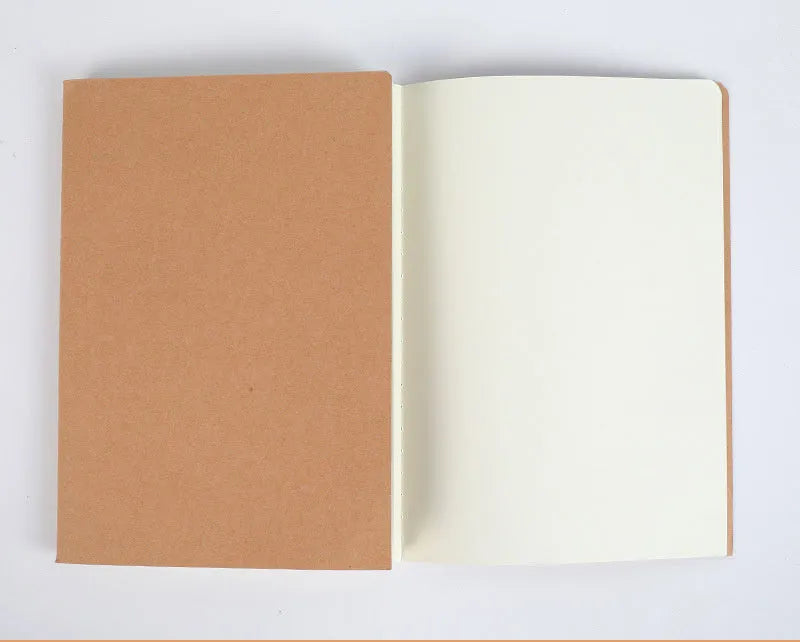 Beige leather thread-bound notebook open showing soft paper with ruled lines.