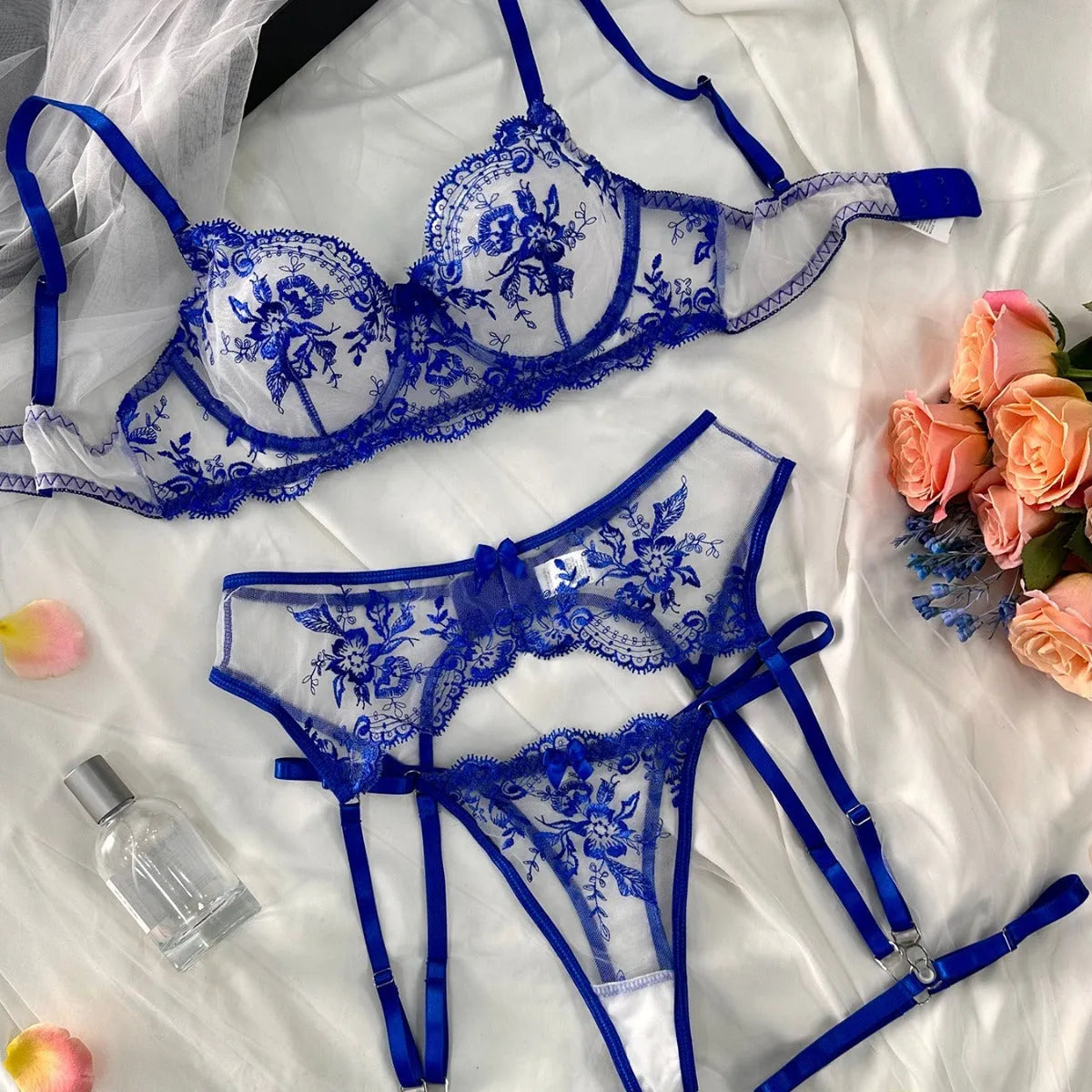 Women's embroidered see-through cutout lingerie set with garters in sapphire blue