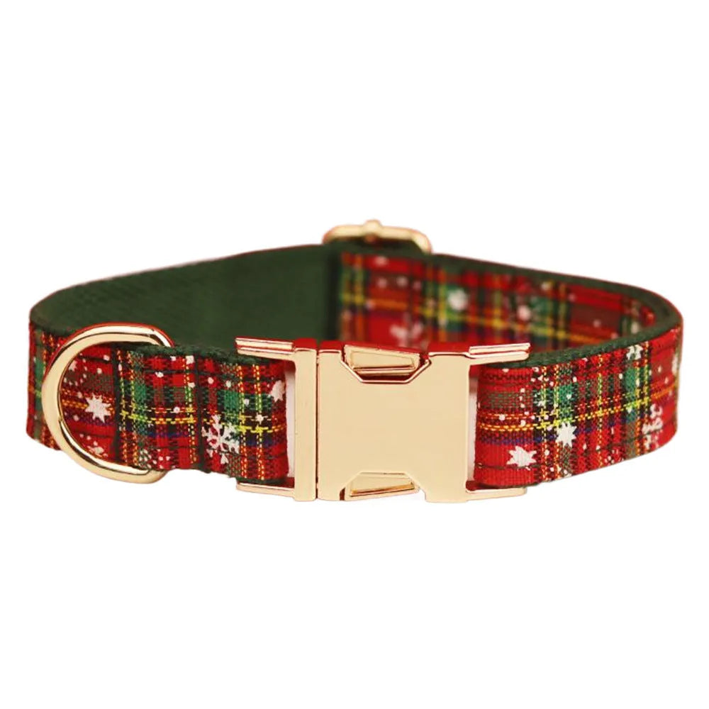 Christmas pet collar four-piece set with green background snowflake design showing dog collar, leash, vest and matching bow