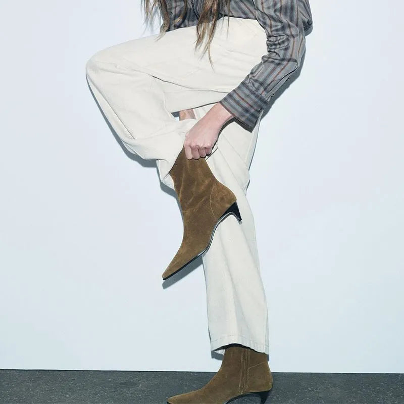 Brown square toe high heel ankle boots with a side zip and a stiletto kitten heel.