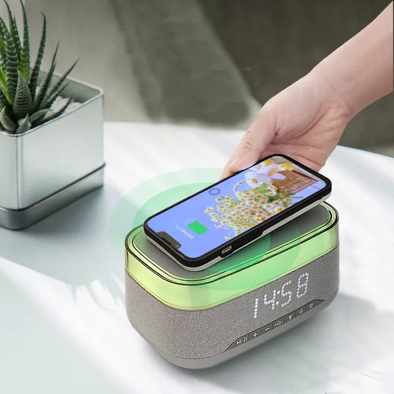 White multifunctional alarm clock with Bluetooth speaker and wireless charging pad
