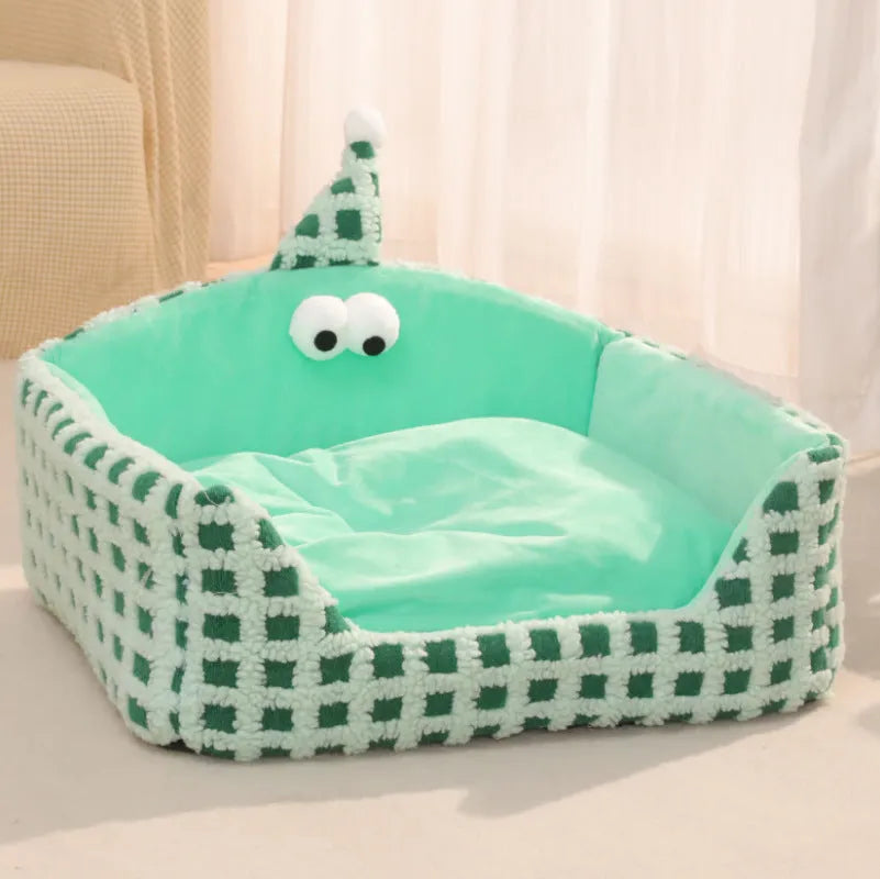 Green triangular cat bed with removable sponge pad, shown disassembled for washing.