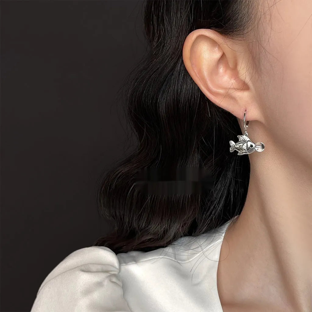 A pair of original design Bubble Fish earrings made from copper with an electroplated finish, featuring goldfish animal modelling.