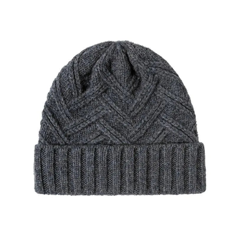 Wool knitted dome crown beanie hat for women in ankela red with a totem pattern.