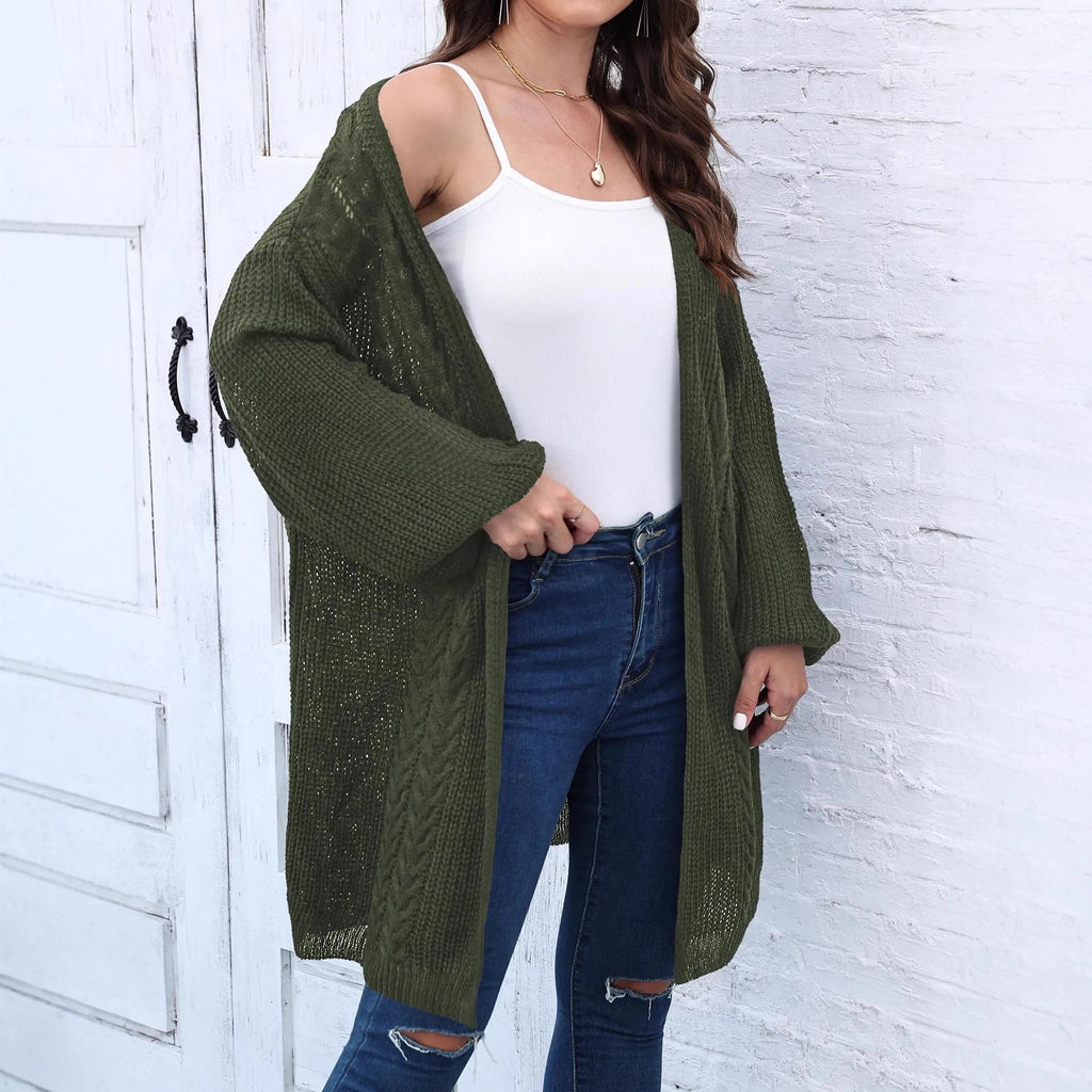 Women's loose-fitting solid colour acrylic sweater coat on a hanger
