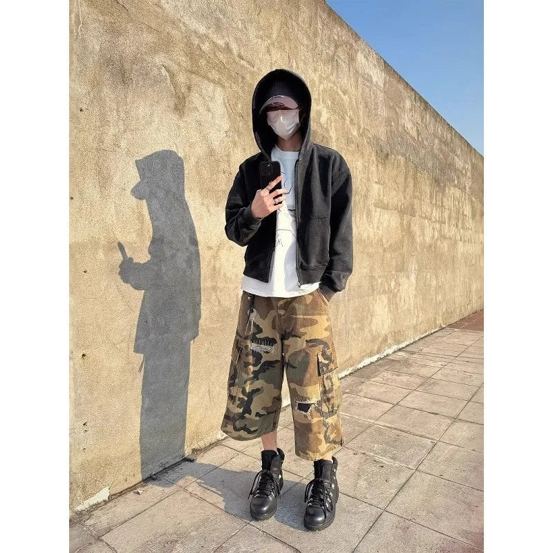 Men's camouflage cropped pants with ripped patches and straight leg cut