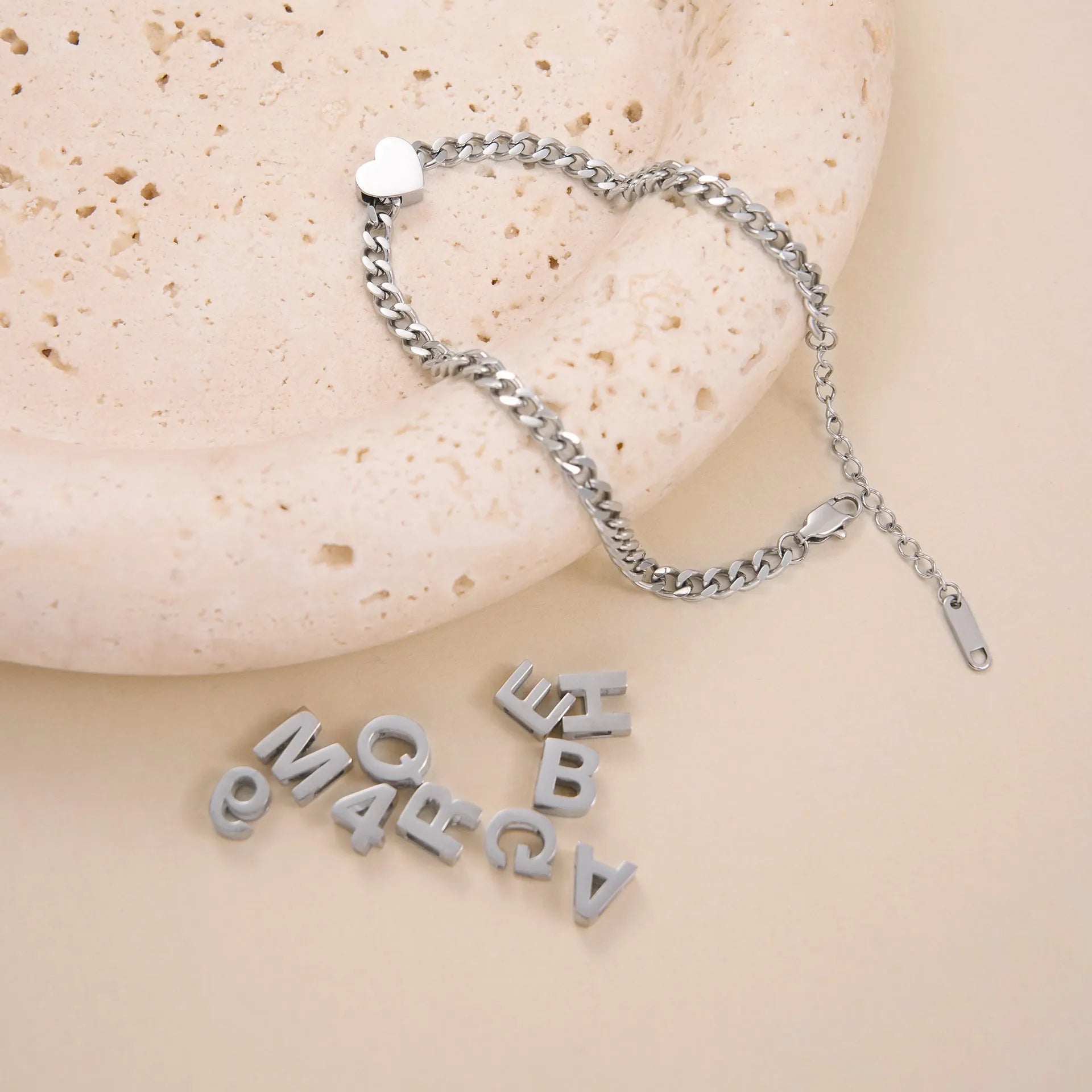 Personalised titanium steel necklace with a single letter A charm on a 40 cm gold chain.