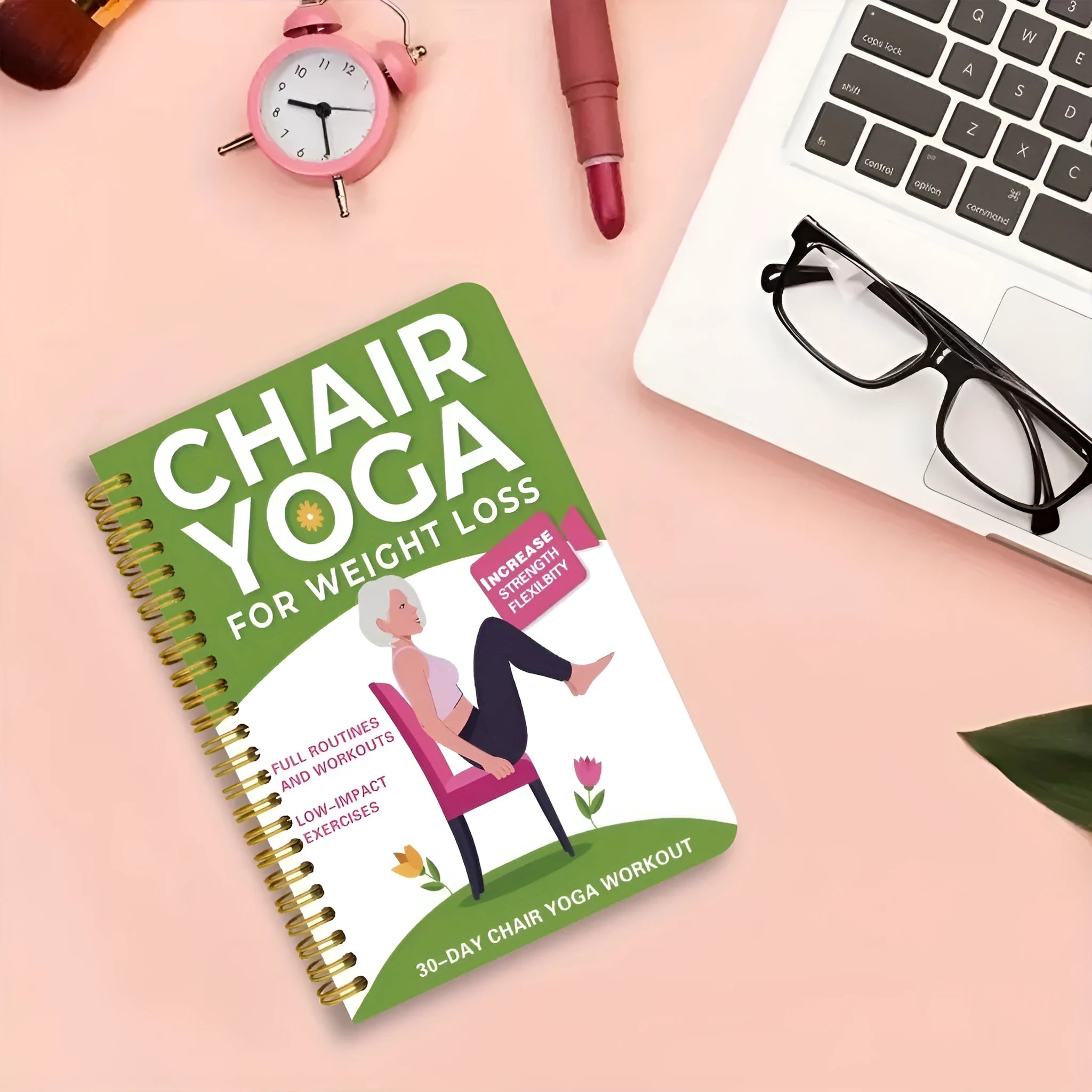 Green coil-bound 30-day yoga training notebook open to daily plan page