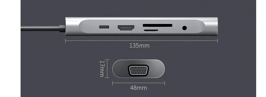 Grey aluminium USB-C docking station showing HDMI, VGA, USB, and charging ports.