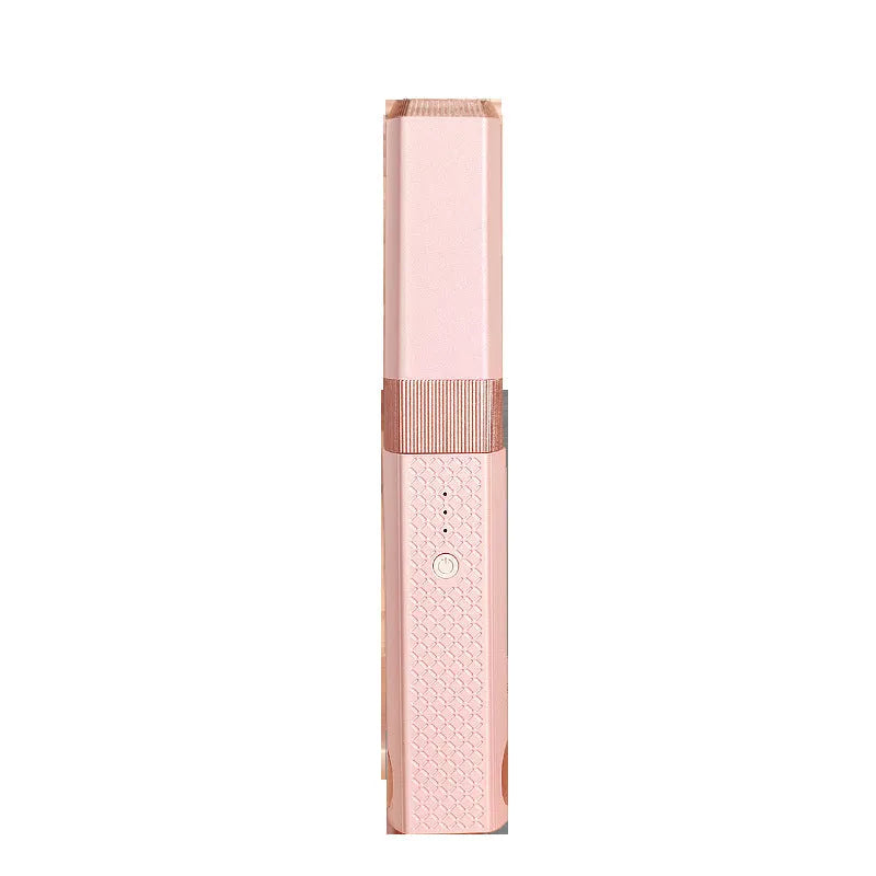 Pink and green mini cordless USB hair straightener and curler with ceramic plates.