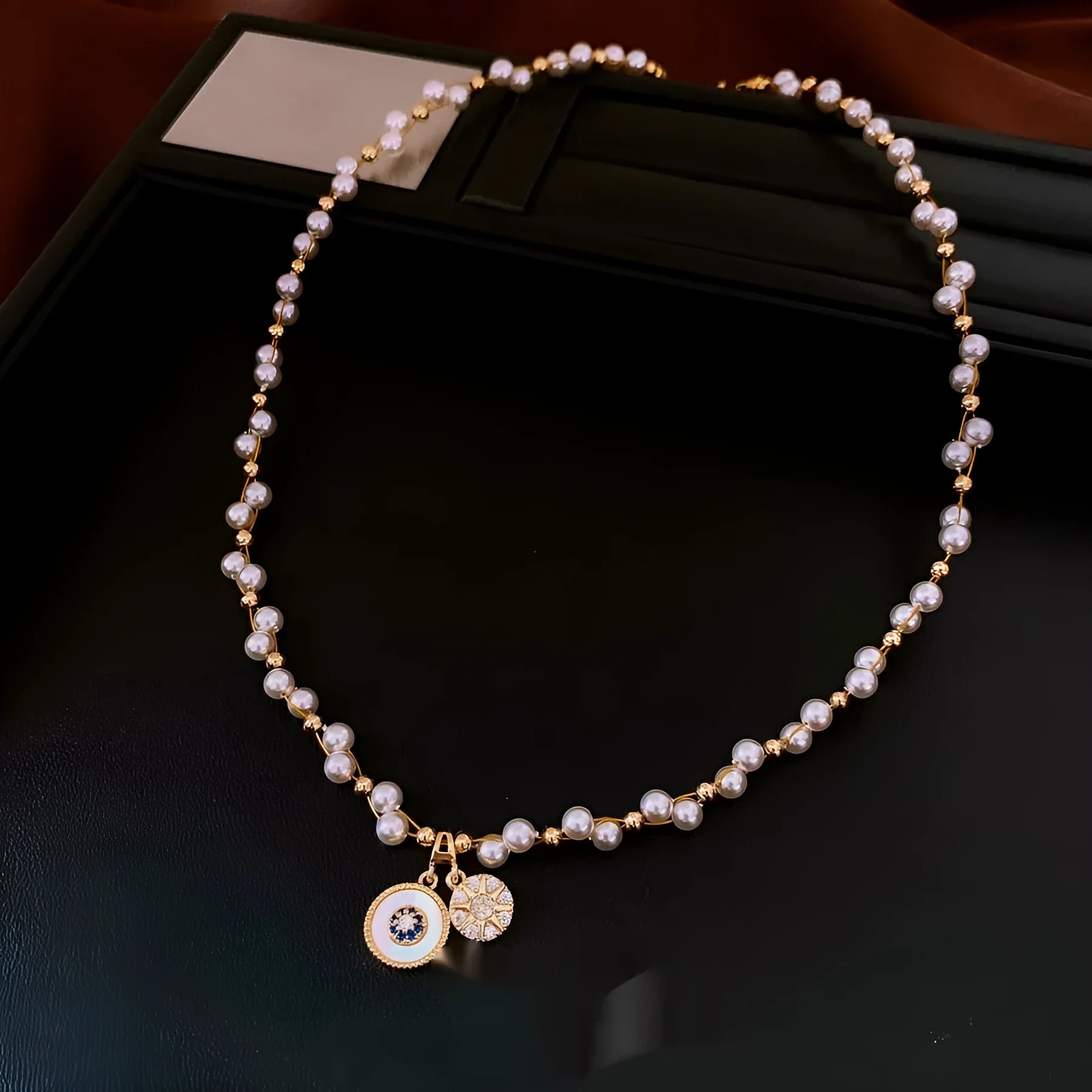 Gold plated clavicle necklace with round imitation pearl and zircon pendant on a 41-50cm chain.