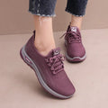Women's mesh breathable casual sneakers in black with cross strap design and round toe