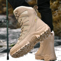 Men's beige cowhide leather hi-top hiking shoes with platform sole on a rocky outdoor surface.
