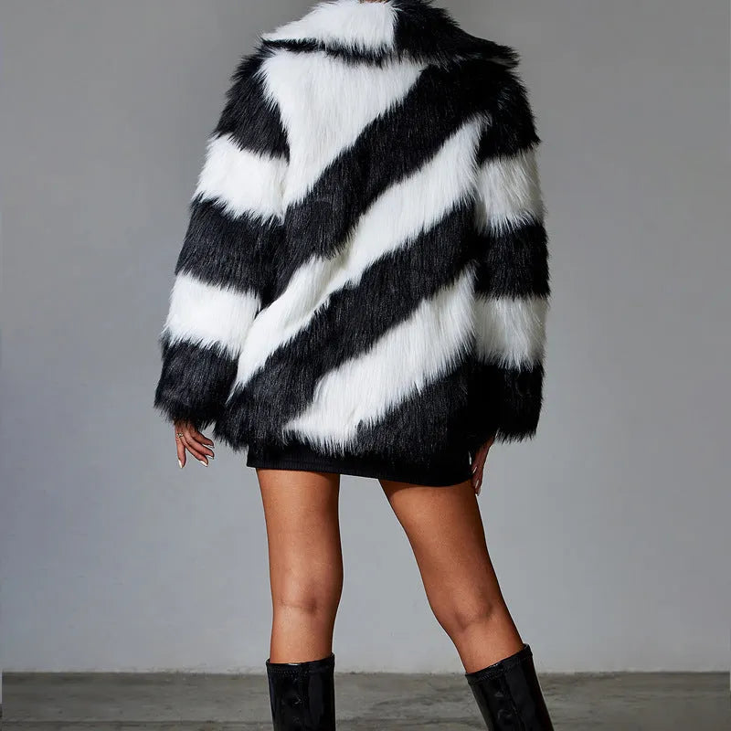 Women's faux fur coat with contrast colour lapel and matching fur collar on a model.