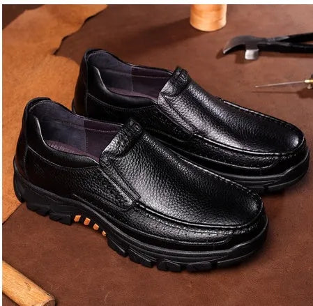 Men's black and brown cowhide leather slip-on business casual shoes with a rubber sole.