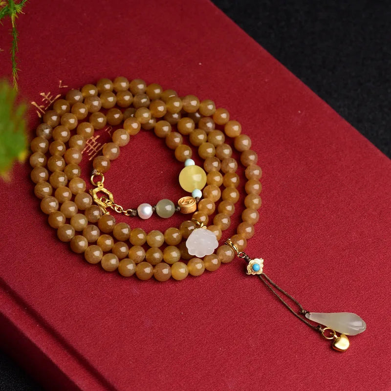 Jade beaded bracelet with green pine 6mm round beads, leaf charms, and beeswax accents