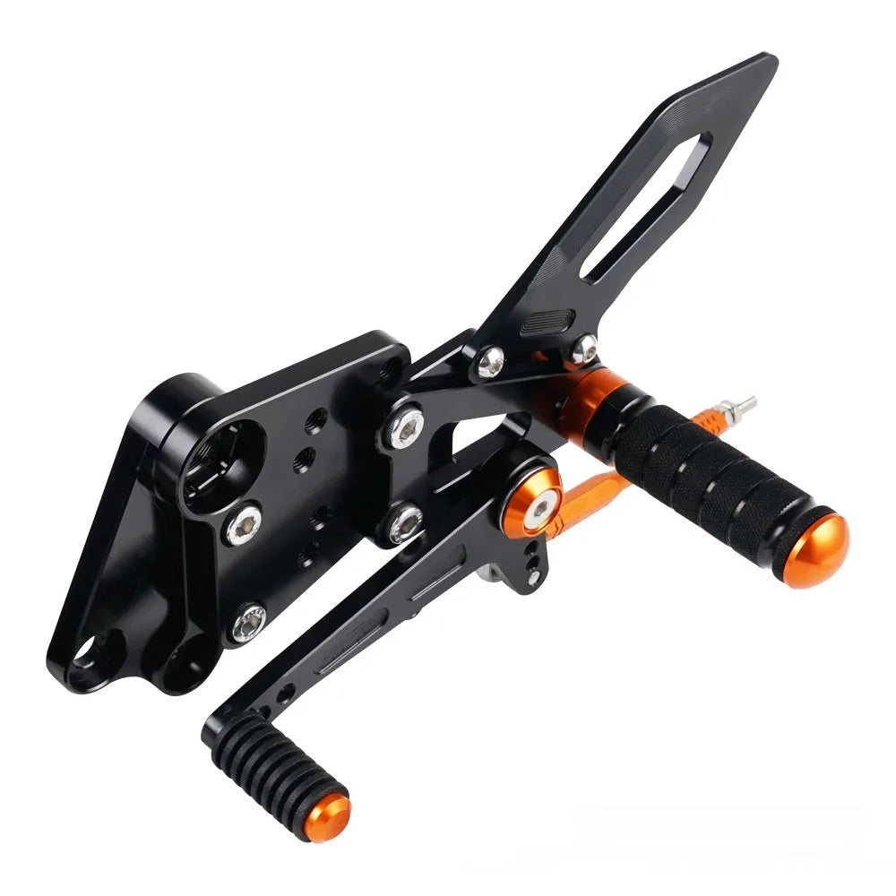 KTM Duke motorcycle raised footpeg support assembly in black and orange colours