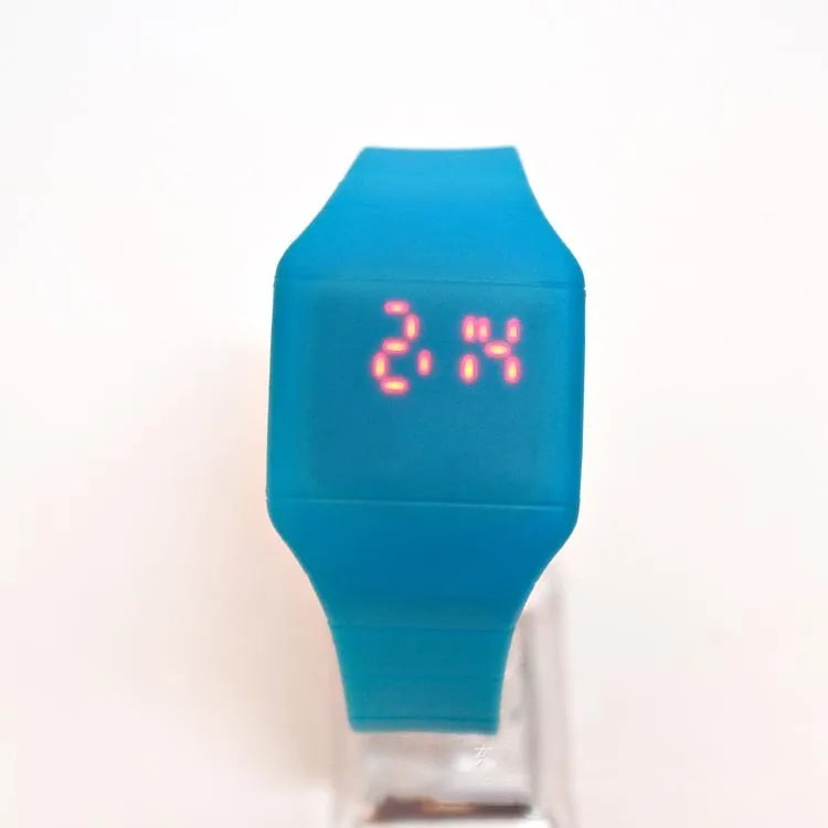 Square electronic touch screen watch showing numeric display on a coloured PU strap.