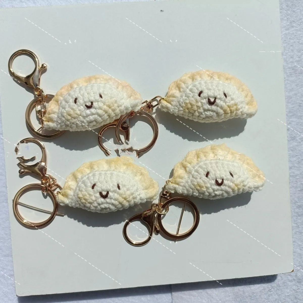 Handmade crochet dumpling pendant with plush material and keychain in traditional dough eye design