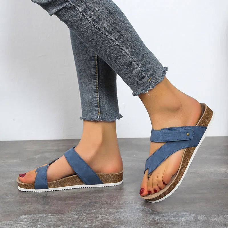 Blue flat toe ring thick-soled flip-flops on a white background.