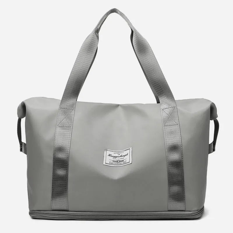 Large capacity Oxford cloth shoulder bag in lake green with multiple zippered pockets for travel