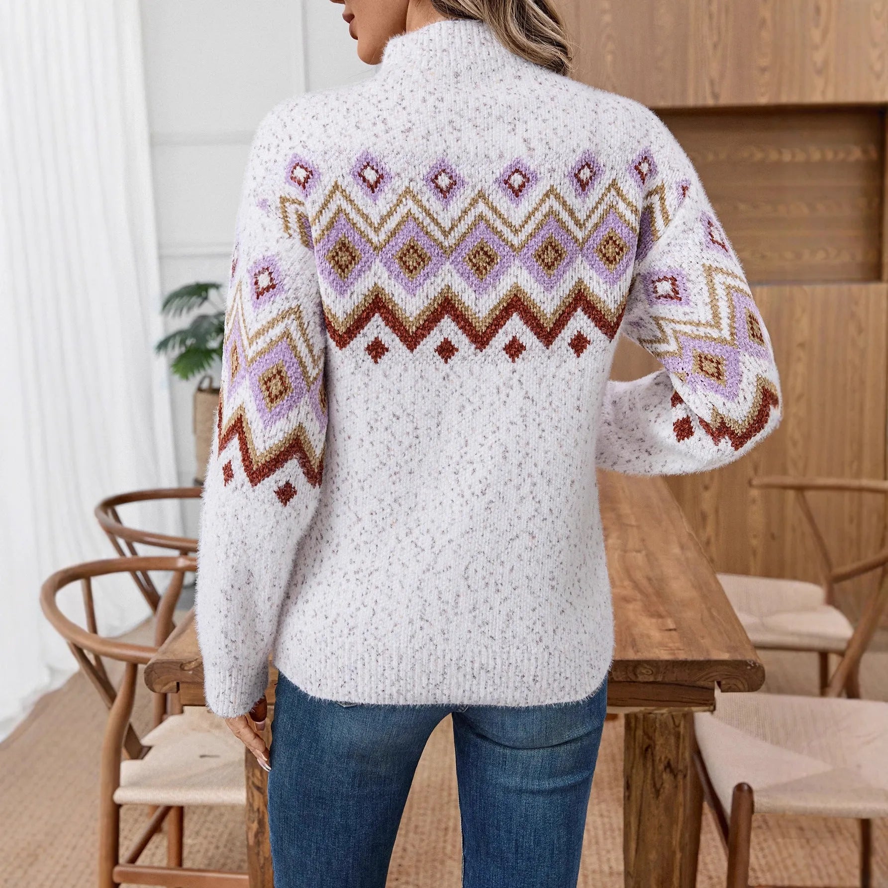 White chunky knit sweater with a geometric jacquard pattern and a half-turtleneck collar.