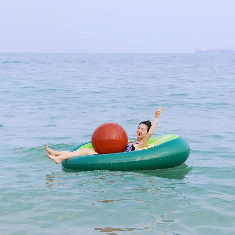 Green giant avocado-shaped inflatable pool float on water