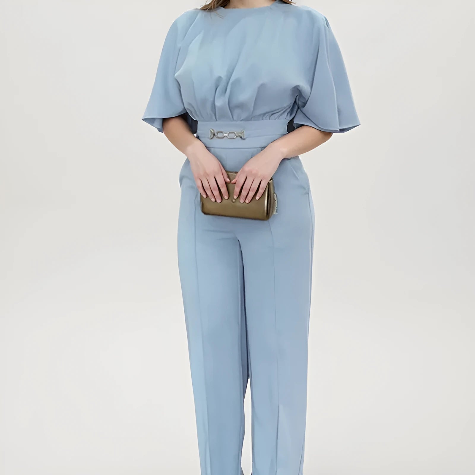 Blue two-piece polyester men's suit with long-sleeve jacket and trousers on a hanger.