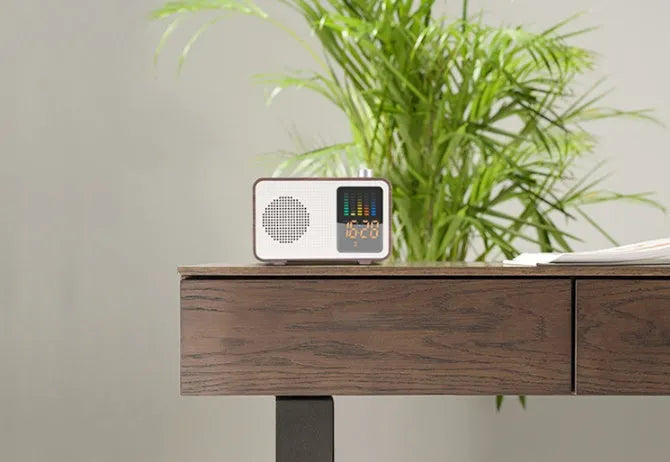 Brown retro Bluetooth radio speaker with wood grain effect and analogue tuning dial