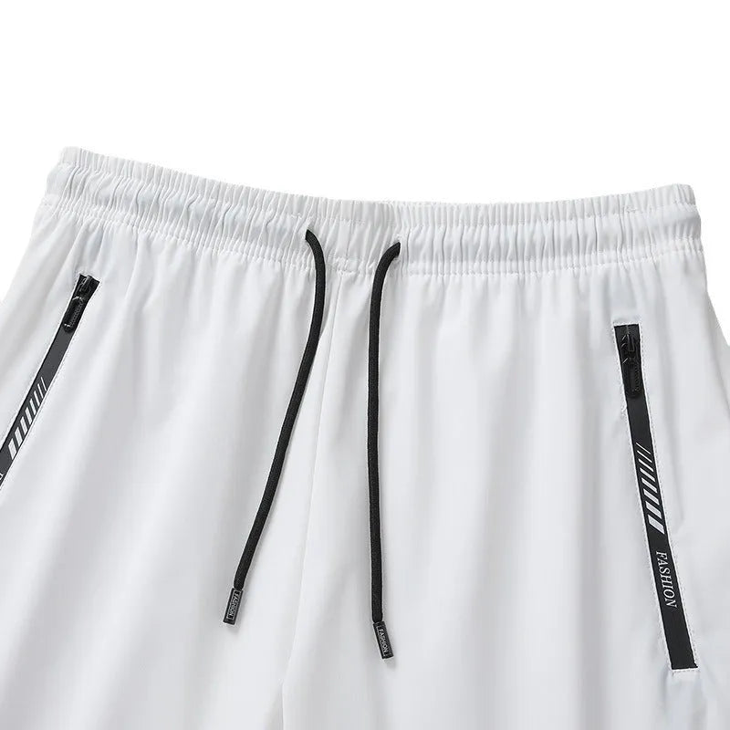 Men's black loose-fit quick-dry nylon sports shorts with elastic waistband.