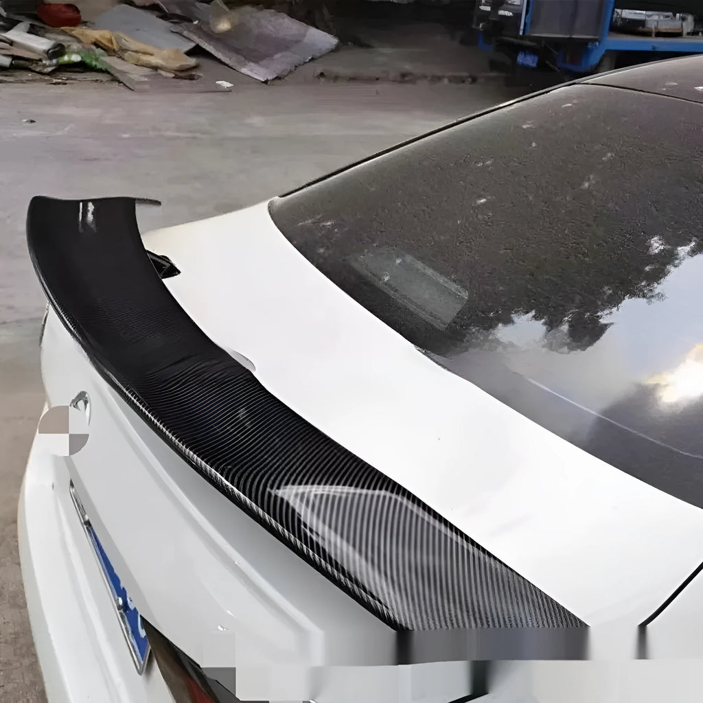 Universal punch-free car tail wing spoiler in ABS plastic shown in bright black and carbon pattern finishes.