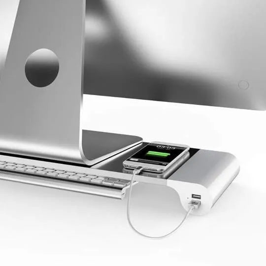 Aluminium and plastic computer monitor stand with four USB ports and hidden keyboard storage underneath