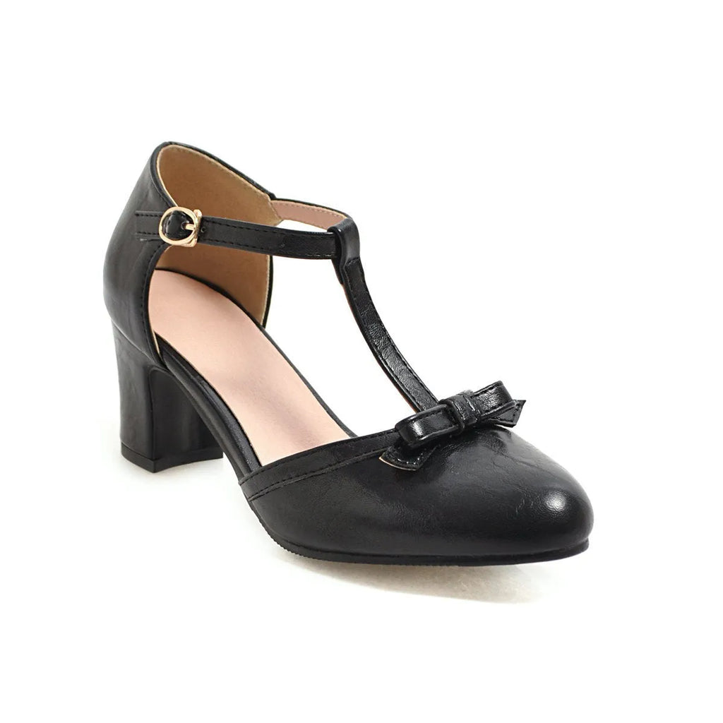 Women's apricot chunky heel sandals with a buckle strap and bow detail on a hollow-out PU upper.