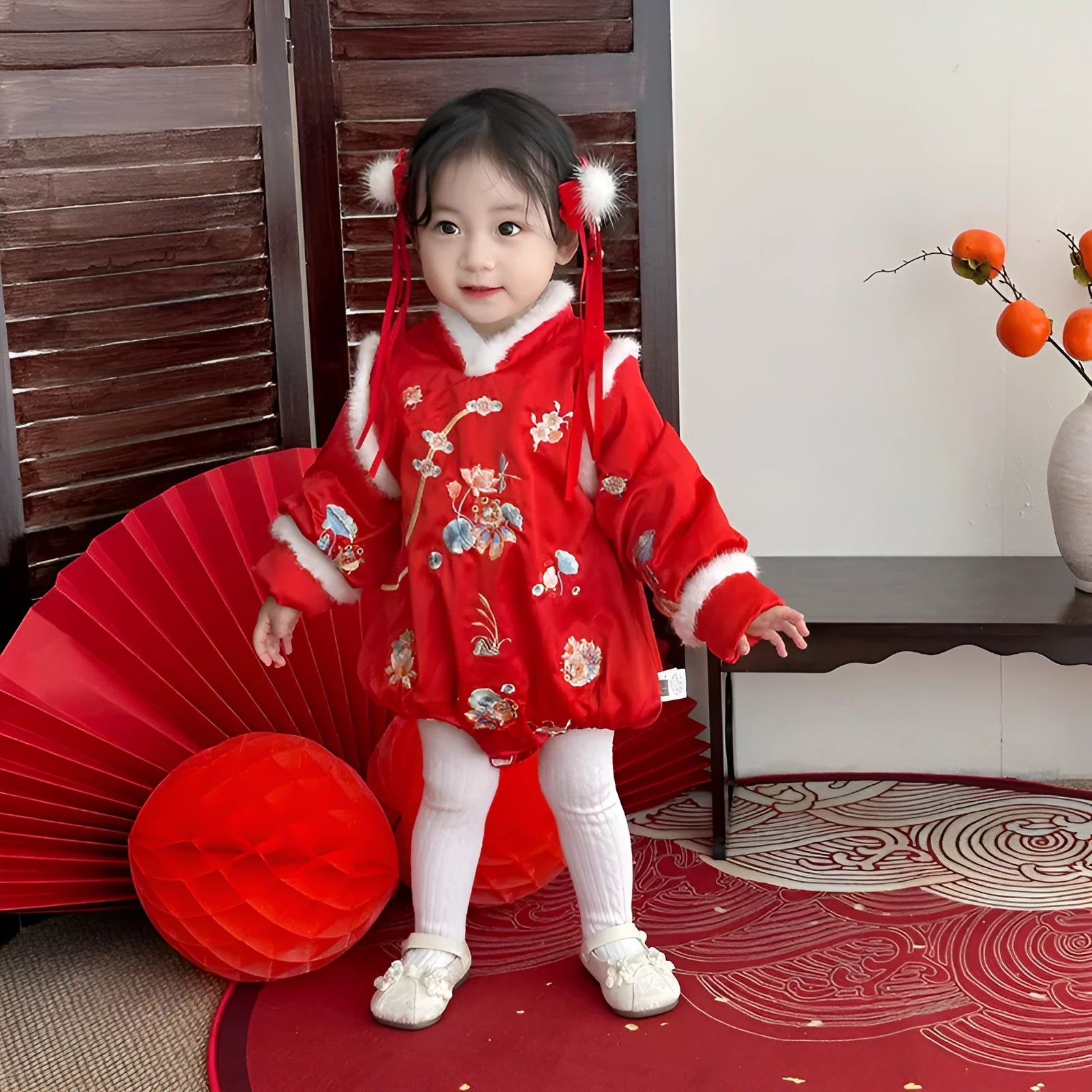 Red thickened baby triangle jumpsuit with long sleeves and pullover style on white background