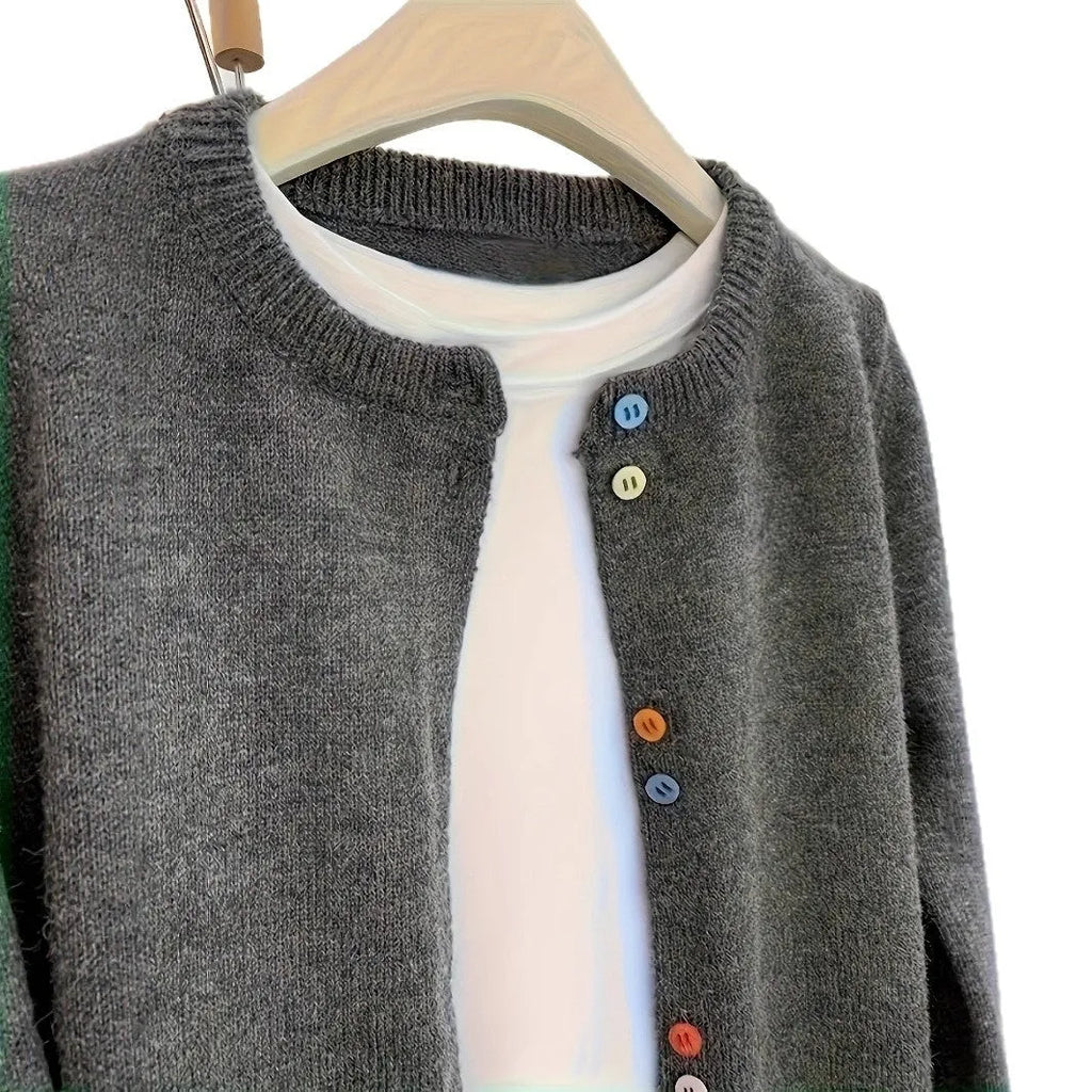Dark grey women's button-front cardigan sweater with long sleeves on a hanger