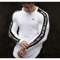 Men's milk silk long sleeve round neck fitness top with letter print in black, shown on a dark background