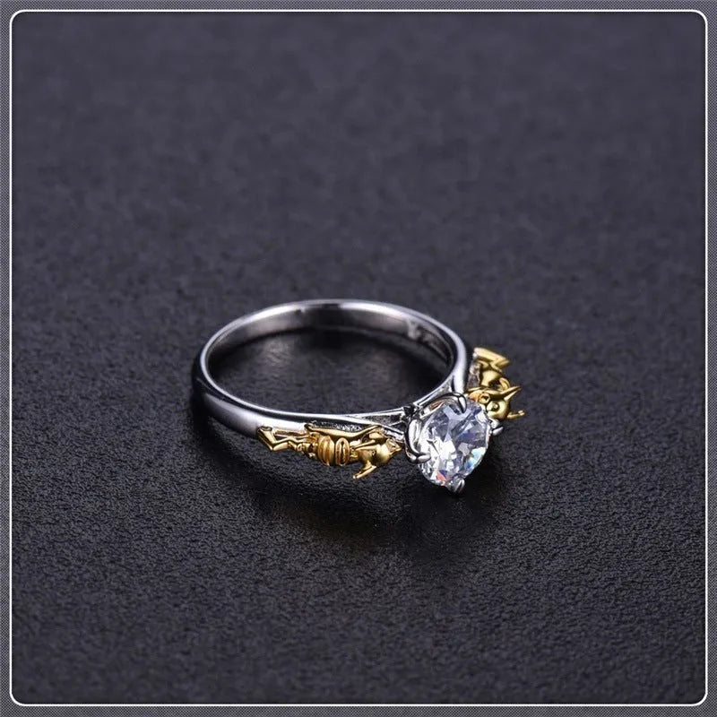 Black gold copper crown modelling ring for cosplay on a plain background.