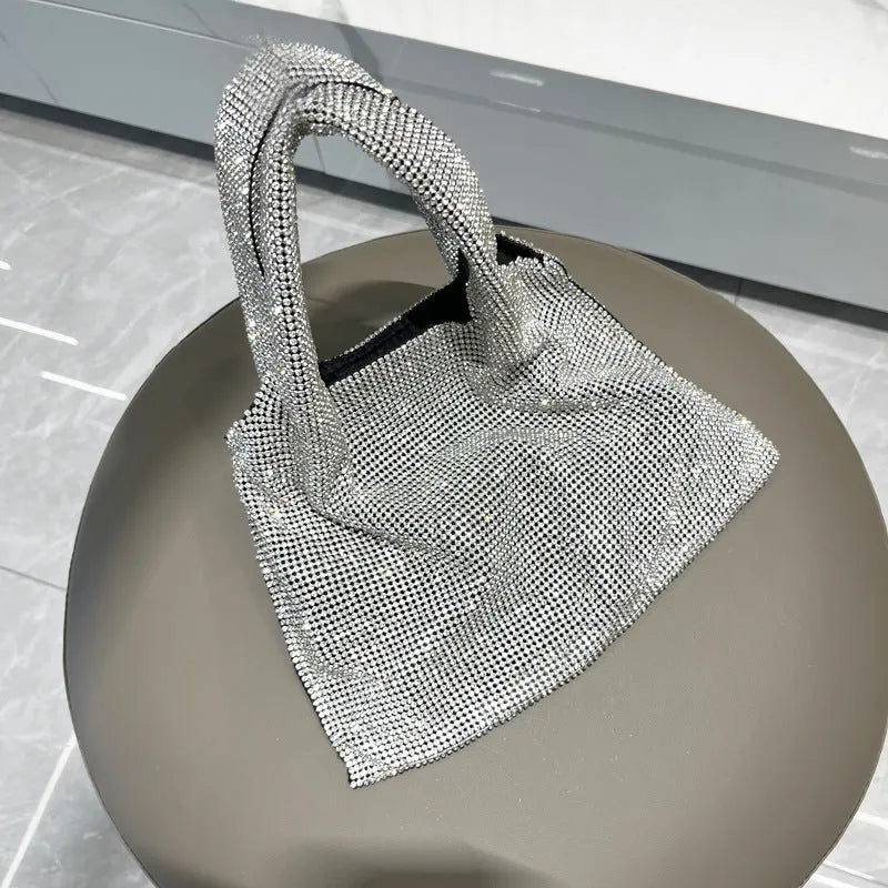 Silver shiny rhinestone evening handbag with open outer pocket for women's parties.